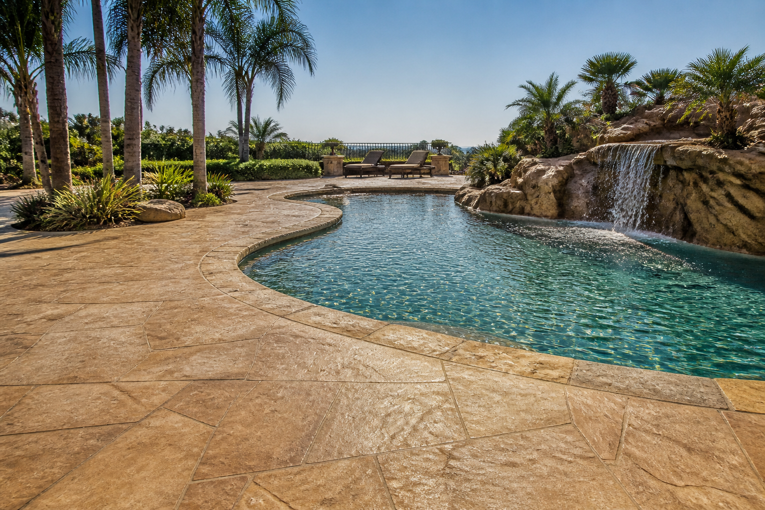 Stamped concrete pool deck in a luxury California backyard