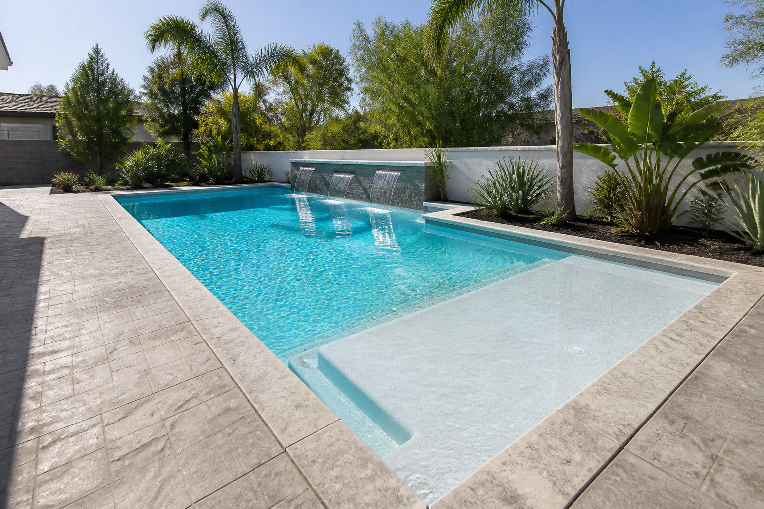 Modern geometric swimming pool with Baja shelf and turquoise water